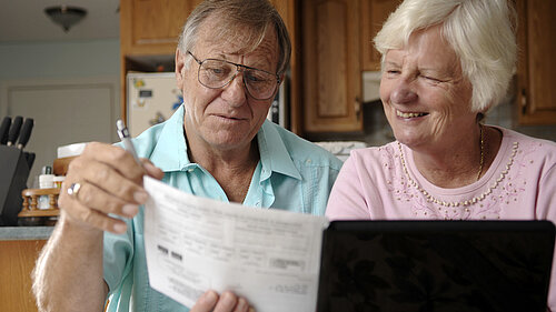 A couple sorting out their bills